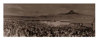 Panoramic view of internees arriving at camp